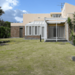 株式会社間仁田建設のロゴ